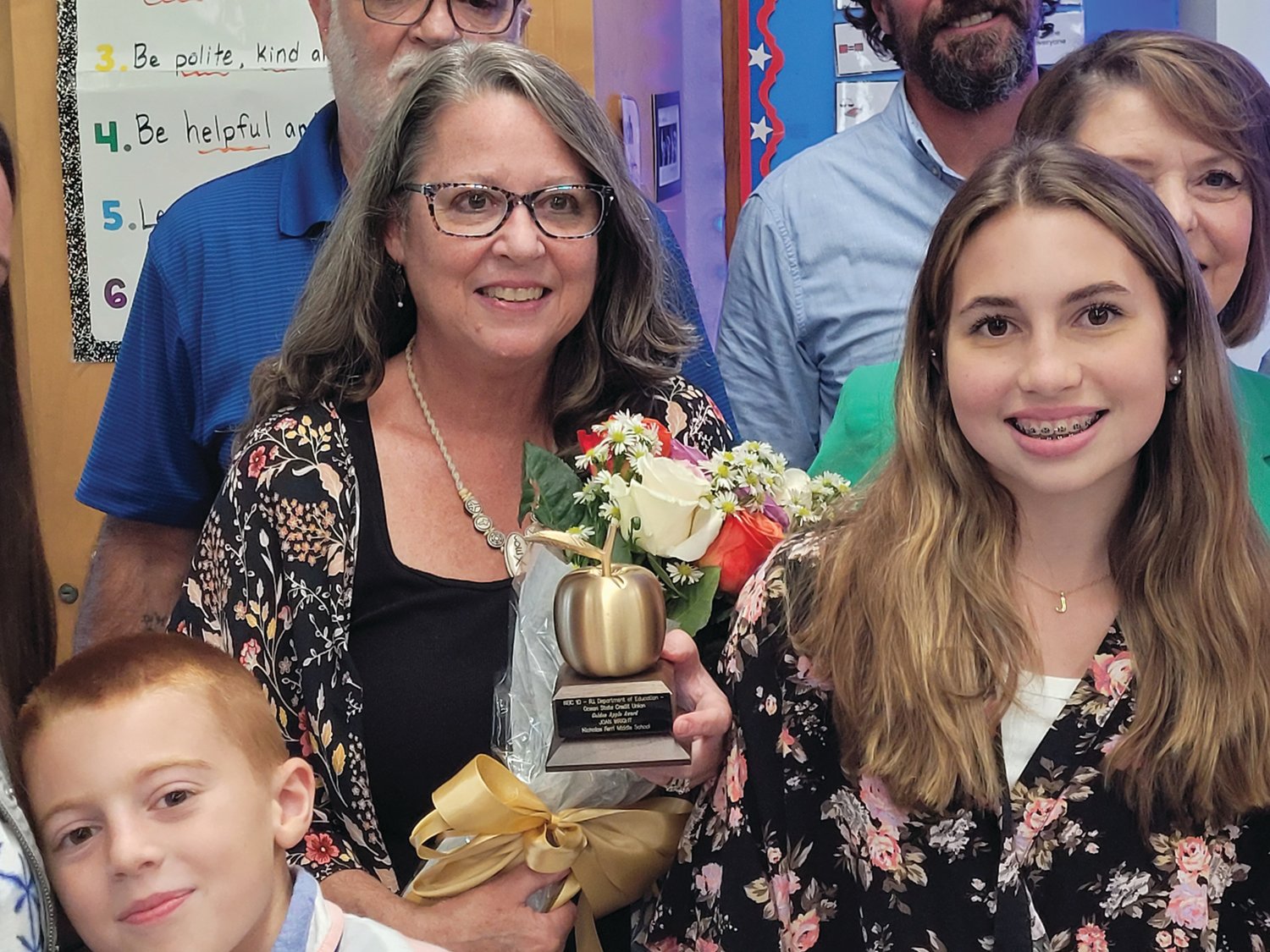 AN INSPIRATION: Nicholas A. Ferri Middle School Teacher Joan Wright held her “Golden Apple” close to her heart after the award ceremony last week.
